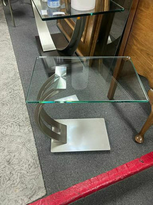 Modern End Table with Curved Silver Metal Base and Glass Top