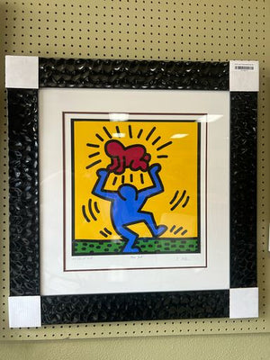 Haring Figure Holding Radiant Baby Art